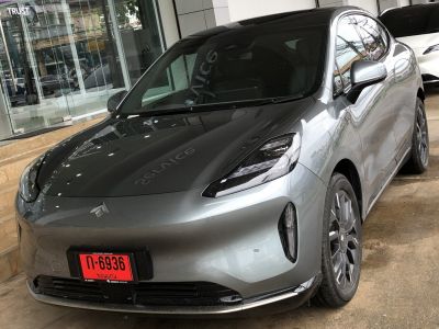Front-angle view with LED headlights and aerodynamic smooth body lines.