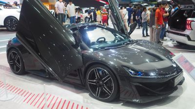 Sports car with butterfly doors and aerodynamic body