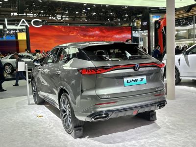 Sleek SUV rear design with continuous LED tail light strip and dual exhaust outlets.