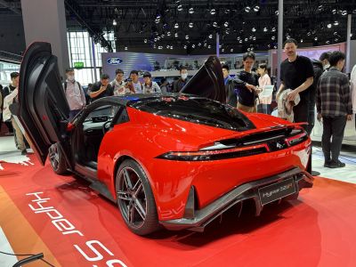 Red sports coupe with butterfly doors and aerodynamic rear