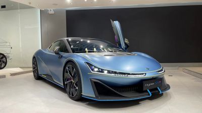 Sleek sports coupe with aerodynamic body and scissor doors
