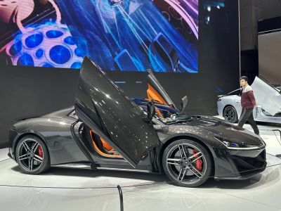 Luxury sports car with butterfly doors and carbon fiber body
