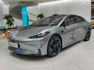 Aerodynamic electric sedan with sleek design and unique alloy wheels