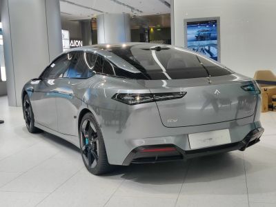 Rear view of electric sedan with LED taillights and aerodynamic roofline