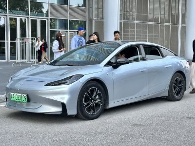 Aerodynamic electric sedan with sleek LED headlights and alloy wheels