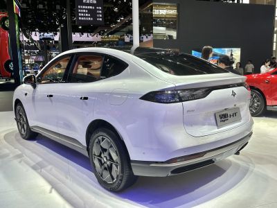 Sleek white coupe SUV with aerodynamic roof and futuristic rear LED lights