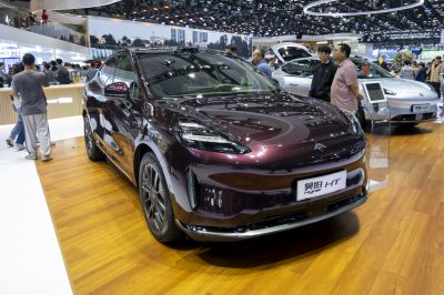 Front view of electric SUV with sleek headlights and modern design