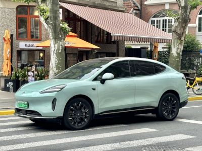 Sleek aerodynamic electric crossover with flush door handles and black alloy wheels