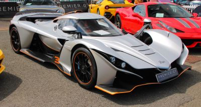 Silver aerodynamic supercar with carbon fiber and aggressive styling