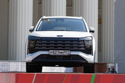 Front view with prominent grille and LED headlights
