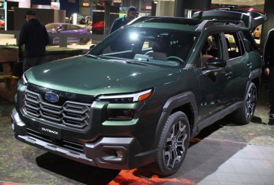Bold honeycomb front grille and modern LED headlights on rugged SUV.