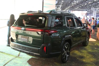 Rear and side view of an SUV with rugged design, modern taillights, and roof rails