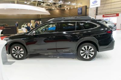 Black SUV side profile with roof rails and alloy wheels