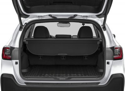 Open rear cargo area with privacy cover and rear headrests.