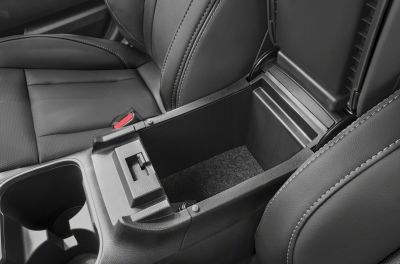 Center console storage compartment and cup holders in black interior