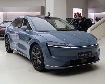Sleek electric crossover SUV with LED light bar and aerodynamic body