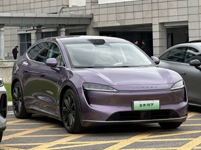 Sleek electric sedan front with aerodynamic design and LED headlights