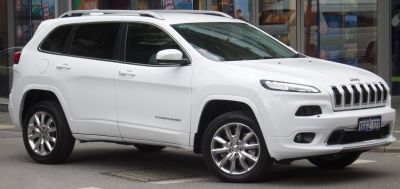 Front-side view with seven-slot grille and sleek body lines