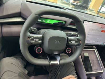 Steering wheel with digital instrument cluster and touchscreen interior