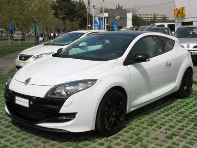 White sporty coupe with aggressive front and black wheels