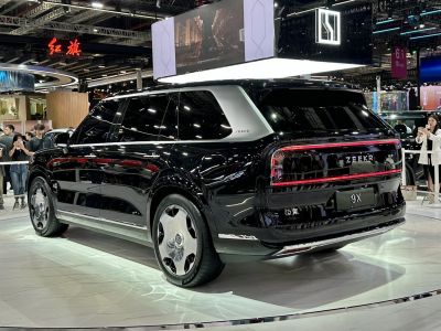 Rear and side view of sleek electric SUV with distinctive taillights and unique alloy wheels