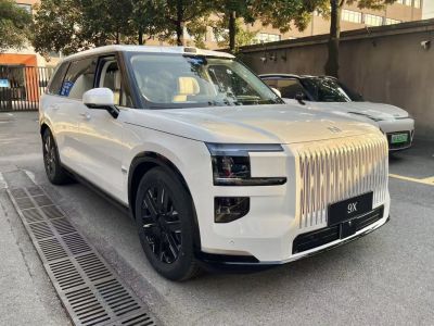 Luxury SUV with tall vertical grille and boxy shape