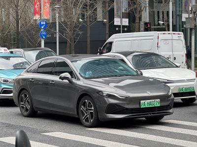 Sleek electric sedan with sharp LED headlights and alloy wheels