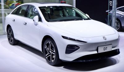 Front and side view of a sedan with slim LED headlights and alloy wheels