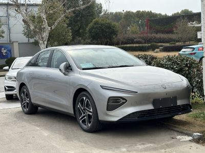 Sleek electric sedan with slim LED daytime running lights and coupe-like styling