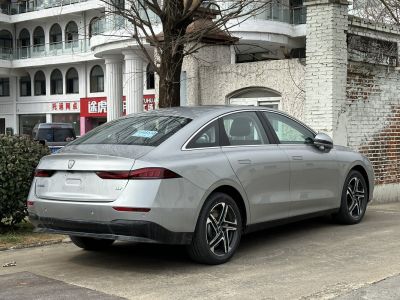 Sleek silver sedan rear side view with modern taillights and alloy wheels