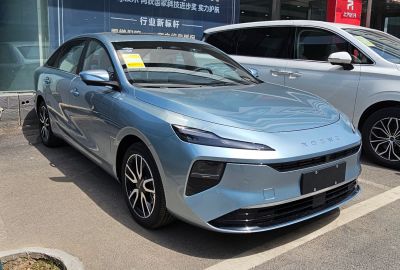 Sleek front view with slim LED headlights and aerodynamic design