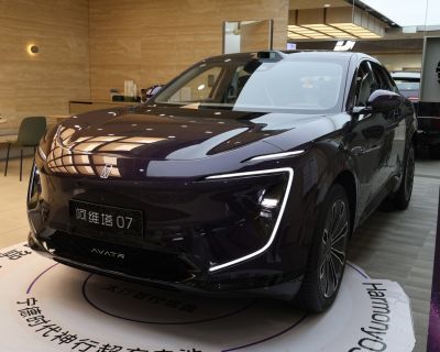 Sleek electric SUV front with distinct LED headlights and aerodynamic design.