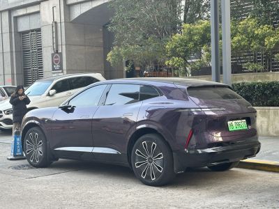 Modern SUV with sleek body, distinctive rear lights, and futuristic alloy wheels
