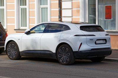 Rear side profile of modern electric SUV with LED taillights and aerodynamic design
