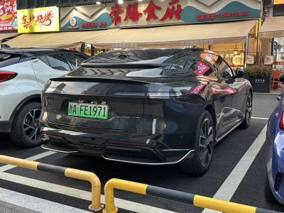 Sleek rear design with continuous taillight strip and smooth aerodynamic shape