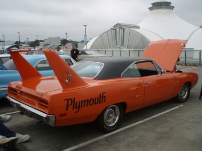 Tall rear wings with bright orange body and black vinyl roof