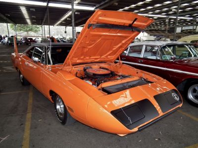 Raised hood showing engine bay and tall rear wing