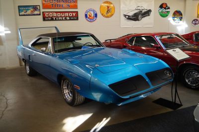 Aerodynamic nose and towering rear wing of a classic muscle car