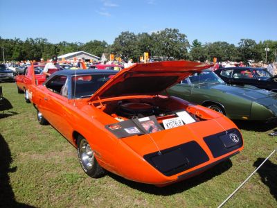 Raised hood showing engine bay of a classic muscle car