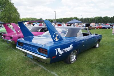 Large distinct rear wing and Plymouth side decals on a classic muscle car