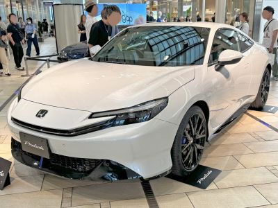 Sleek front design with LED headlights and black alloy wheels