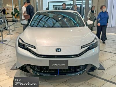Sporty front view with sharp headlights and sleek grille