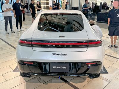 Rear view showcasing sleek taillights and rear design of a modern coupe