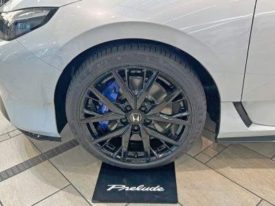Black alloy wheel with blue brake caliper and Continental PremiumContact tire