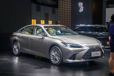 Luxury sedan front and side view with sharp grille and alloy wheels