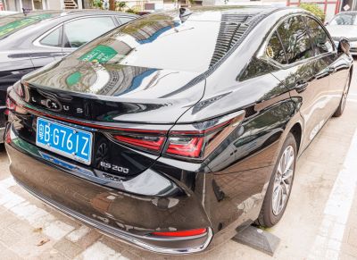 Sleek rear design with sharp LED tail lights and glossy black finish.