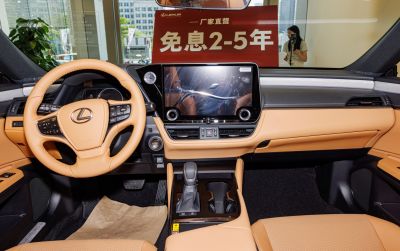 Modern digital dashboard and leather steering wheel in premium car interior