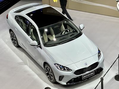 Sleek four-door coupe with sporty design and panoramic sunroof