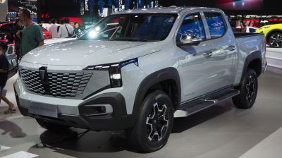Front view of pickup with distinctive grille and sharp LED headlights