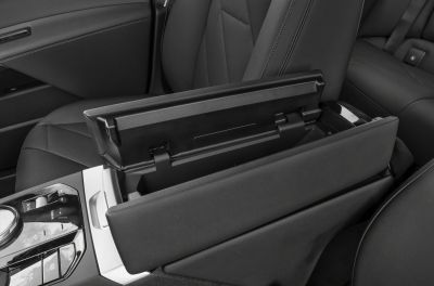 Center console storage compartment with padded armrest in black upholstery